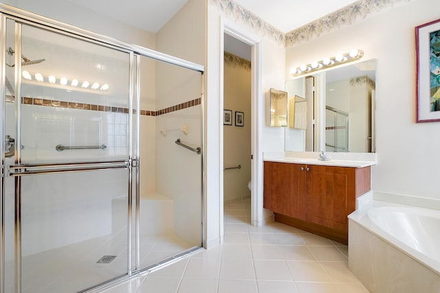 full bathroom with toilet, vanity, plus walk in shower, and tile patterned flooring