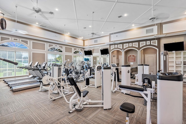 workout area with ceiling fan, carpet flooring, and coffered ceiling