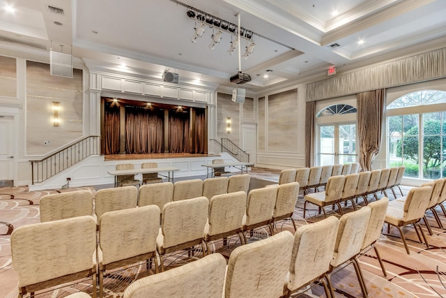 home theater room with coffered ceiling, ornamental molding, and beamed ceiling