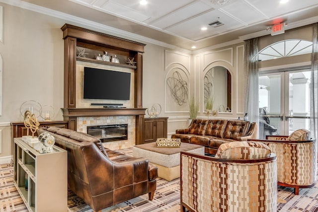 interior space with crown molding, coffered ceiling, a fireplace, and french doors