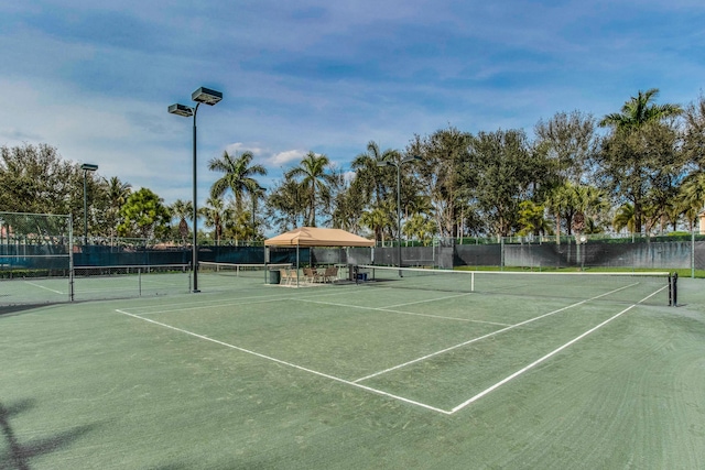 view of tennis court featuring a gazebo