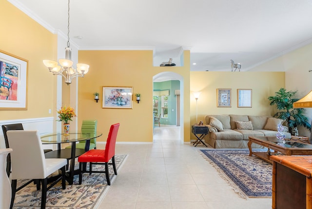 tiled dining room with an inviting chandelier and ornamental molding