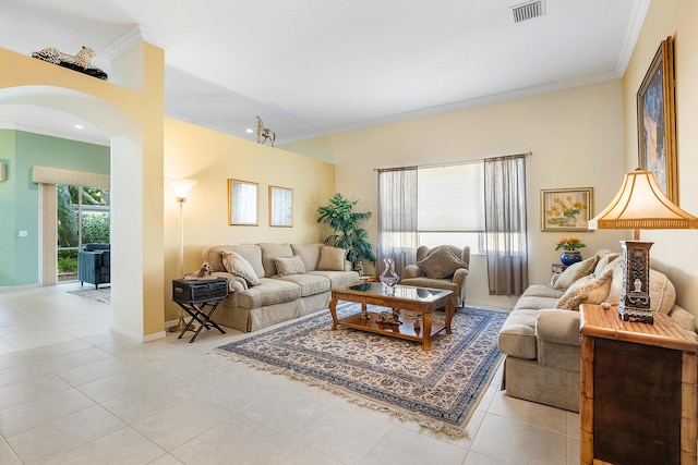 tiled living room featuring crown molding and a wealth of natural light