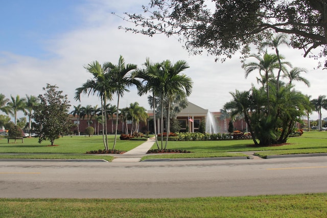 surrounding community featuring a lawn