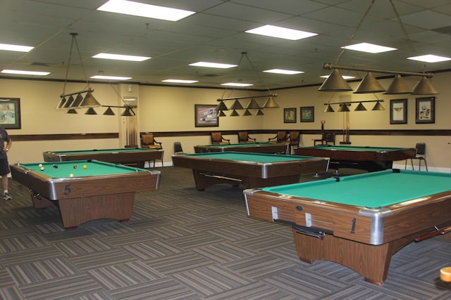 game room with dark carpet, a drop ceiling, and billiards