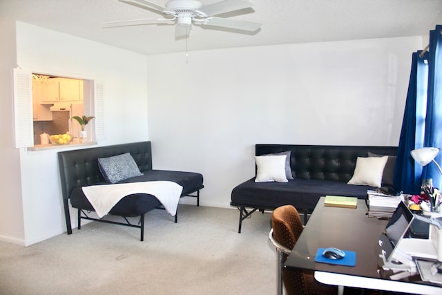 carpeted living room featuring ceiling fan