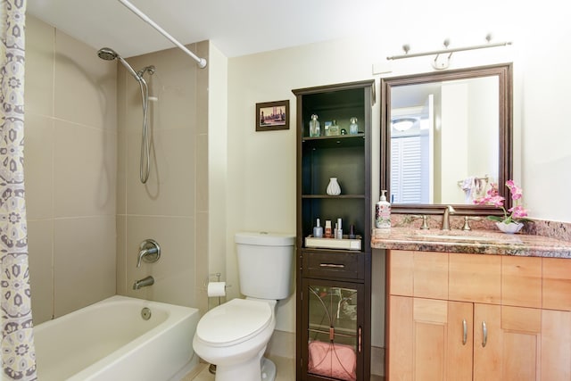 full bathroom with vanity, toilet, and shower / bath combo with shower curtain