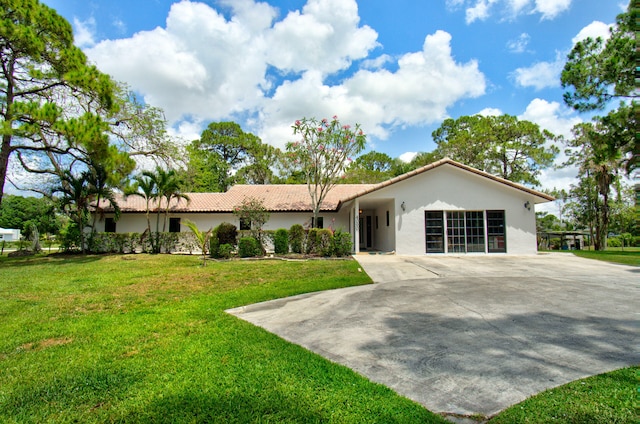 single story home with a front yard