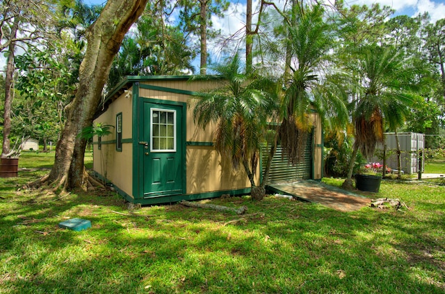 view of outbuilding featuring a yard