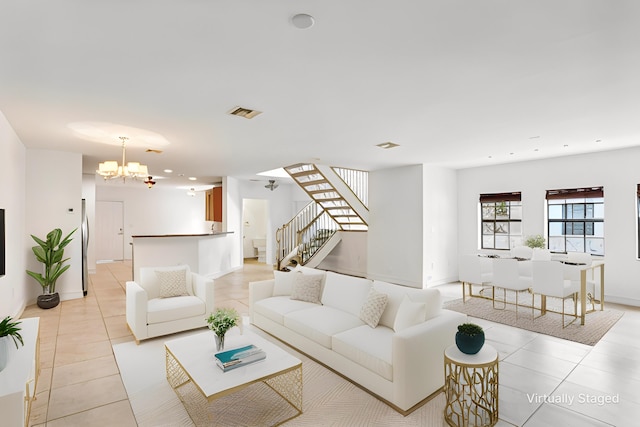 living room featuring visible vents, a chandelier, stairway, light tile patterned floors, and recessed lighting