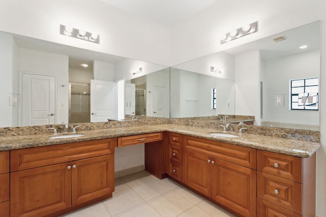 bathroom featuring tile patterned floors and dual vanity