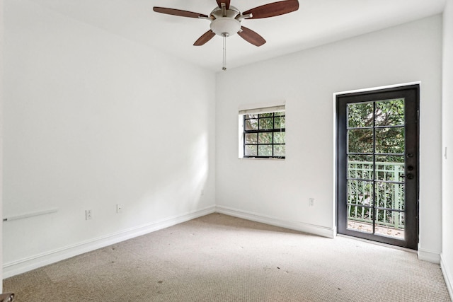 empty room featuring carpet flooring and ceiling fan