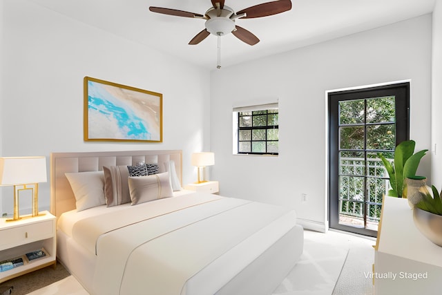 bedroom featuring ceiling fan, light colored carpet, and access to exterior