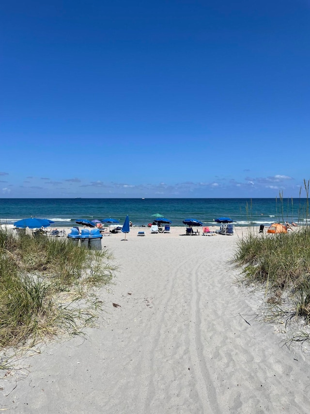 property view of water featuring a beach view