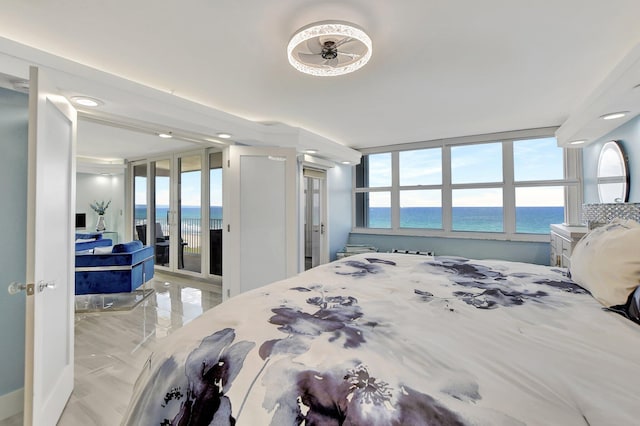 bedroom featuring tile flooring and a water view