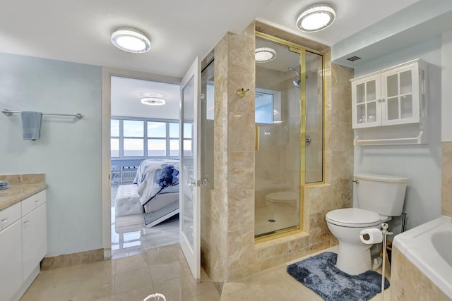 full bathroom with vanity, tile floors, toilet, and shower with separate bathtub