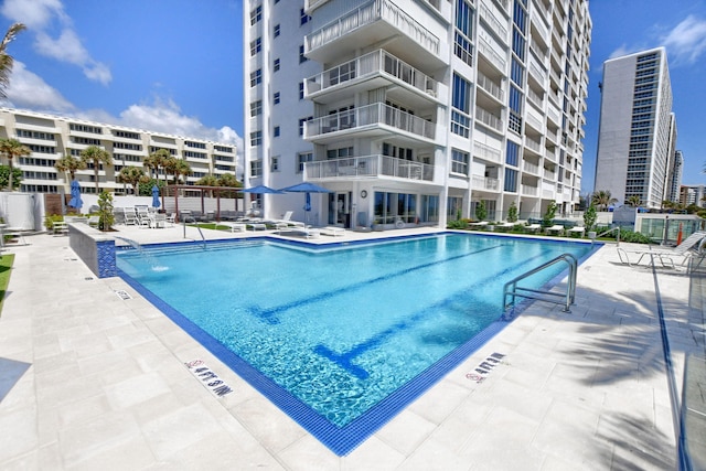 view of pool with pool water feature