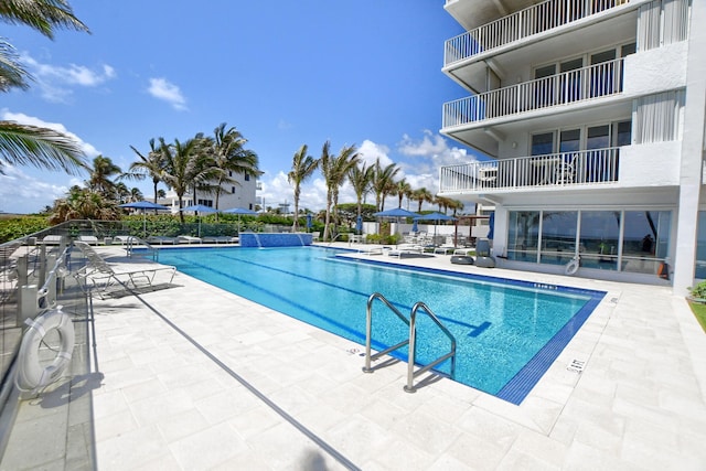 view of swimming pool with a patio area