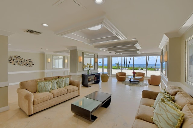 living room featuring a water view and crown molding