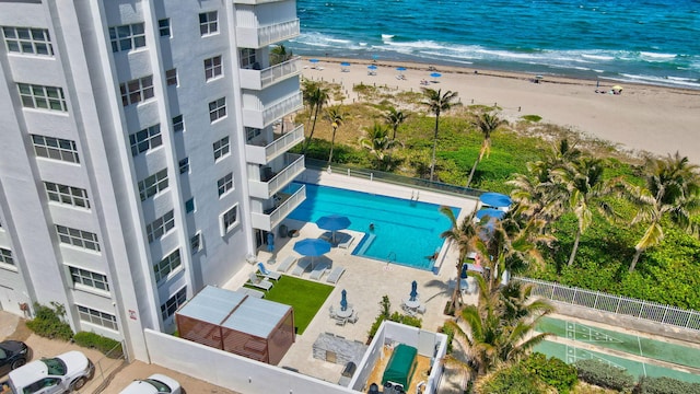 aerial view with a beach view and a water view