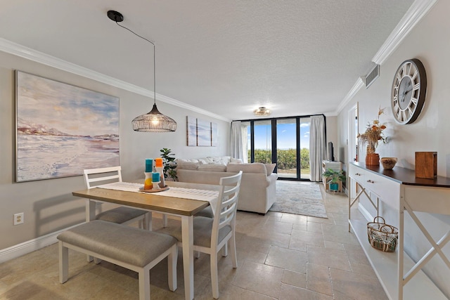 dining room with expansive windows, a textured ceiling, and ornamental molding