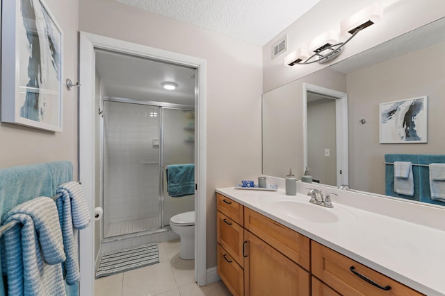 bathroom featuring toilet, tile patterned floors, walk in shower, and a textured ceiling