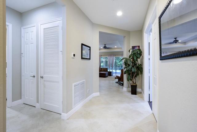 corridor featuring a barn door