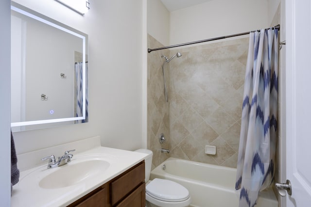 full bathroom featuring shower / bath combination with curtain, vanity, and toilet