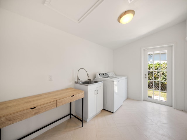 laundry area featuring sink, cabinets, light tile floors, and washing machine and clothes dryer