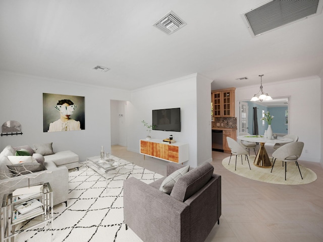 living room featuring ornamental molding, a chandelier, and light tile floors