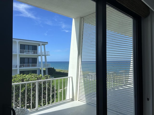 balcony featuring a water view