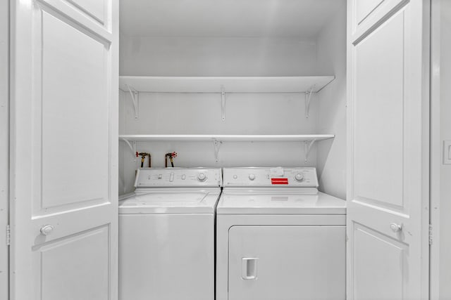 laundry room featuring washing machine and clothes dryer