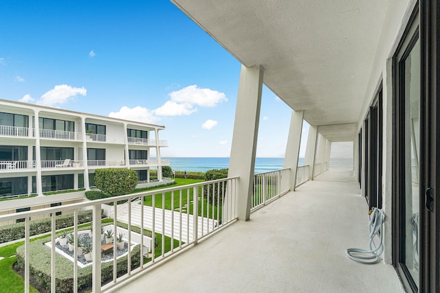 balcony featuring a water view