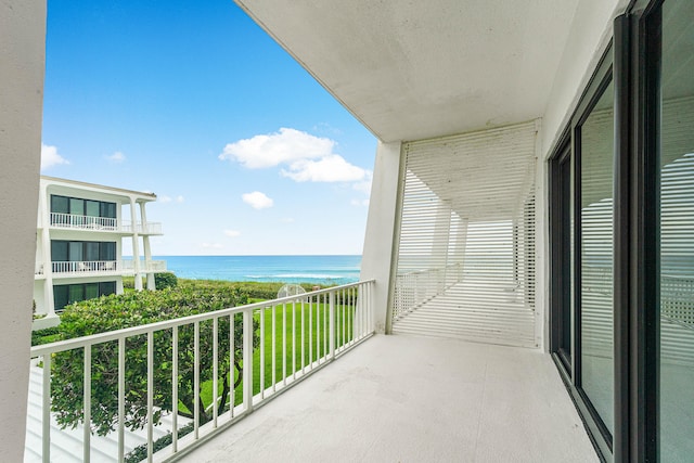 balcony featuring a water view