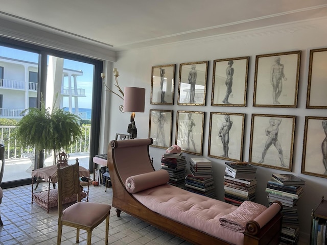 living room with ornamental molding and light tile patterned flooring