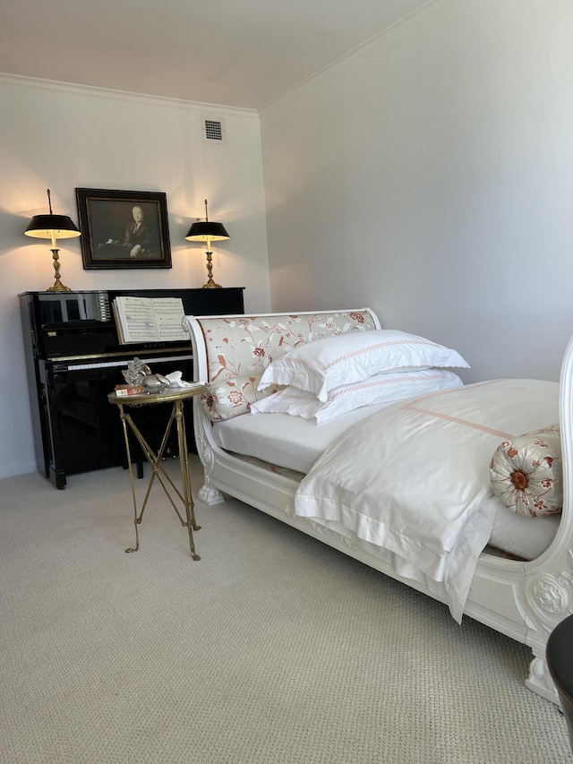 bedroom with crown molding and carpet flooring