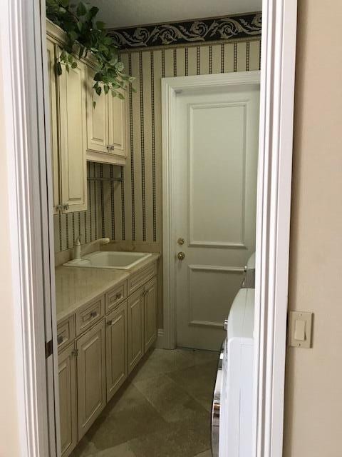 interior space with vanity and tile floors