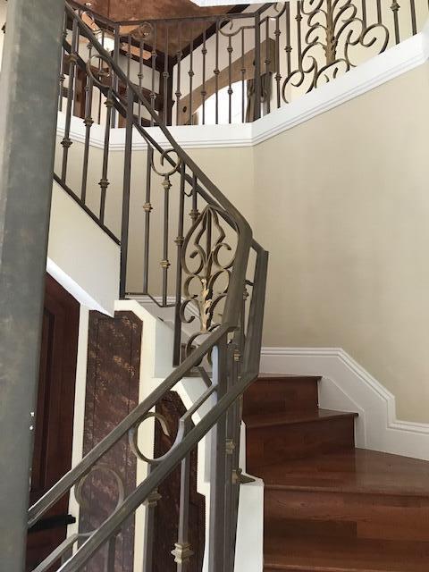 staircase featuring a high ceiling