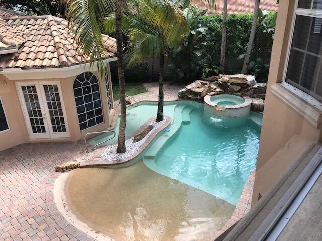 view of swimming pool with a patio and an in ground hot tub