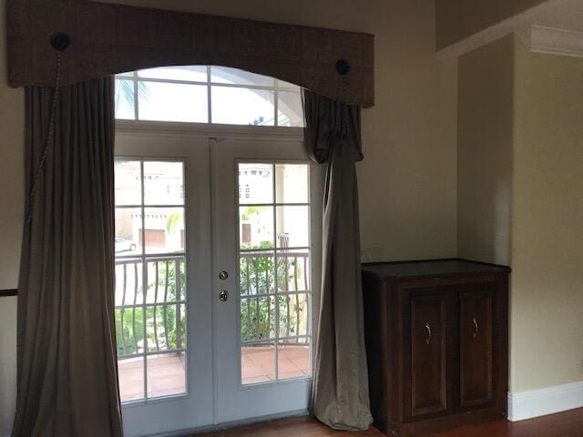 entryway with french doors, hardwood / wood-style flooring, and plenty of natural light