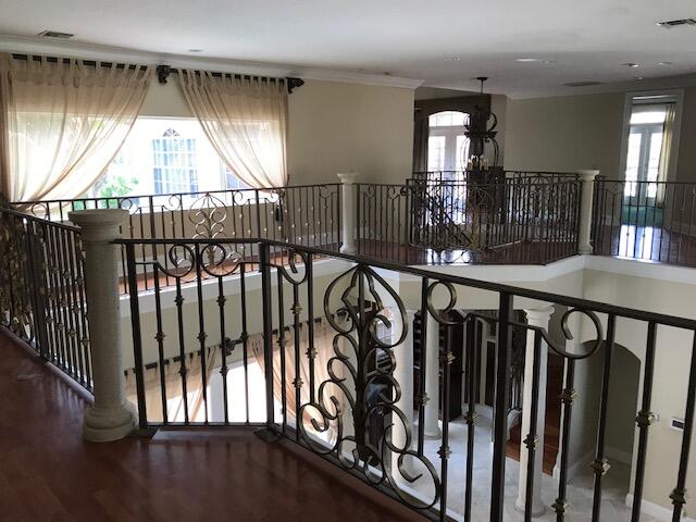 interior space featuring hardwood / wood-style floors and ornamental molding