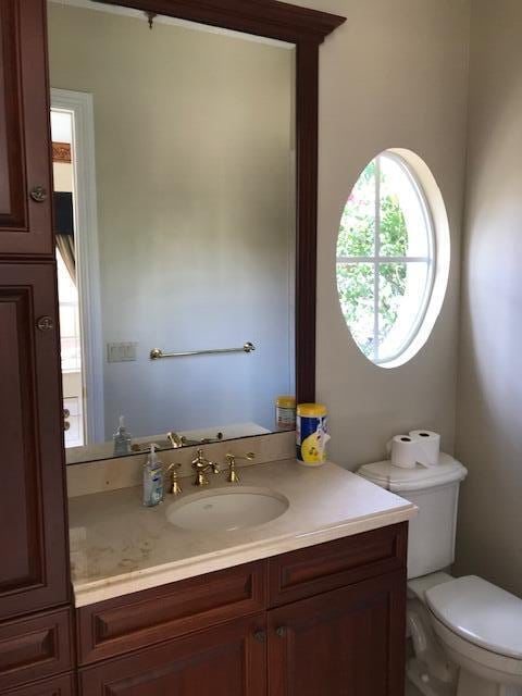 bathroom featuring vanity and toilet