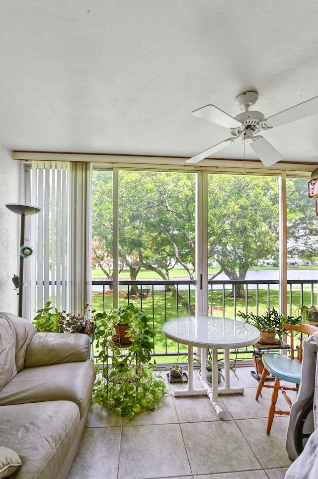 sunroom with ceiling fan and a wealth of natural light