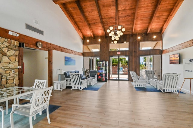 living room featuring wood ceiling, beam ceiling, light hardwood / wood-style flooring, and high vaulted ceiling