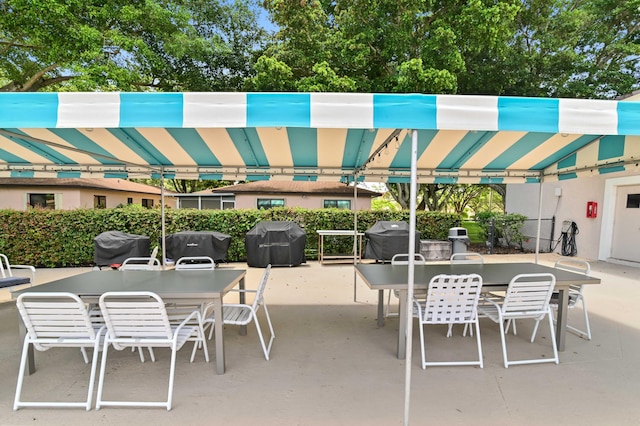 view of patio / terrace with outdoor dining area and a grill