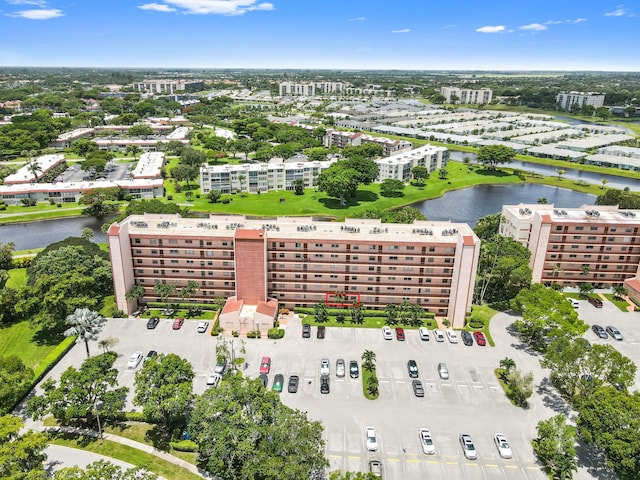 drone / aerial view featuring a water view and a city view