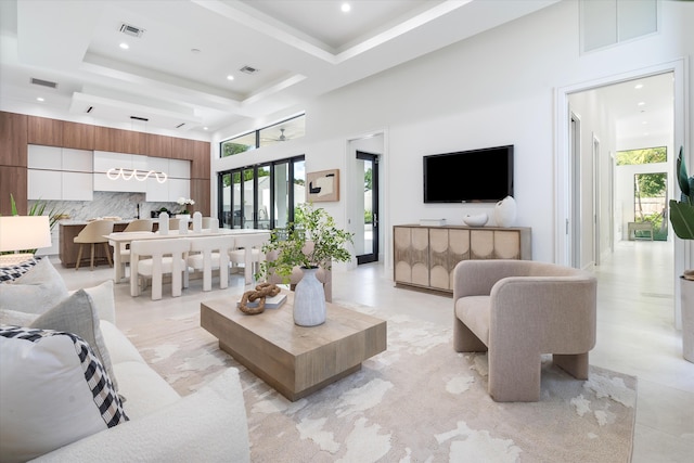 living room with a towering ceiling