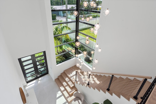 staircase with french doors