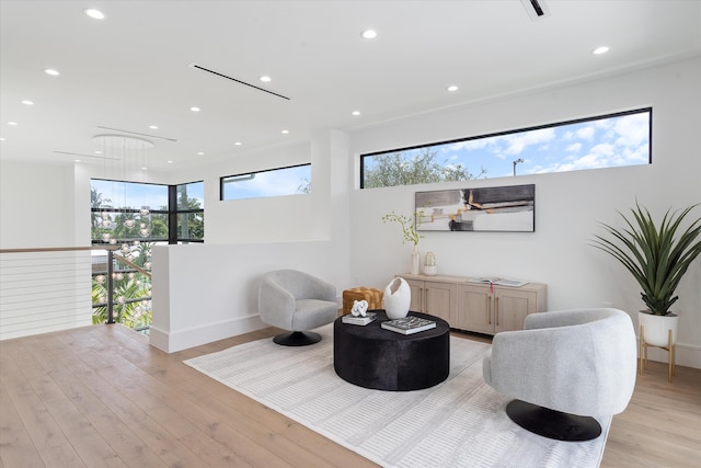 sitting room with light hardwood / wood-style floors