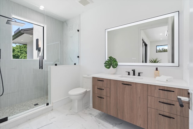 bathroom with walk in shower, vanity, toilet, and plenty of natural light